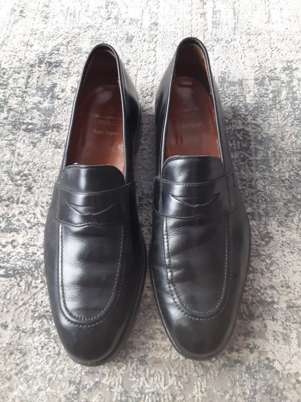 Men's Allen Edmonds Lake Forest penny loafers in black leather.